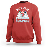 Red crewneck sweatshirt with 'Chillin' With My Snowmies' snowman graphic on front