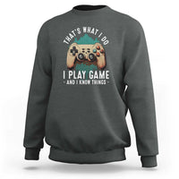 Dark heather crewneck sweatshirt with gaming controller graphic on the chest.