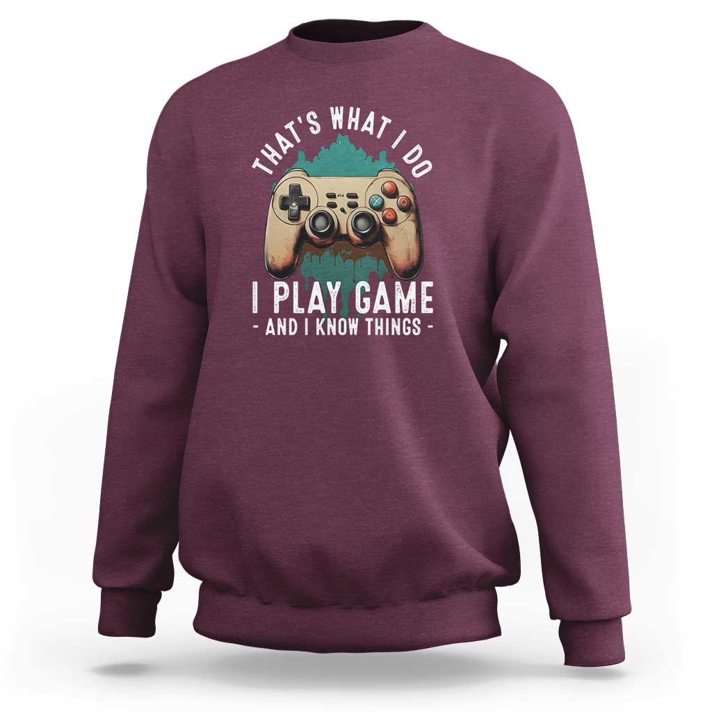 Maroon crewneck sweatshirt with gaming controller graphic on the chest.