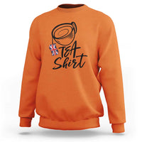 Orange crewneck sweatshirt with "Tea Shirt" graphic and UK flag