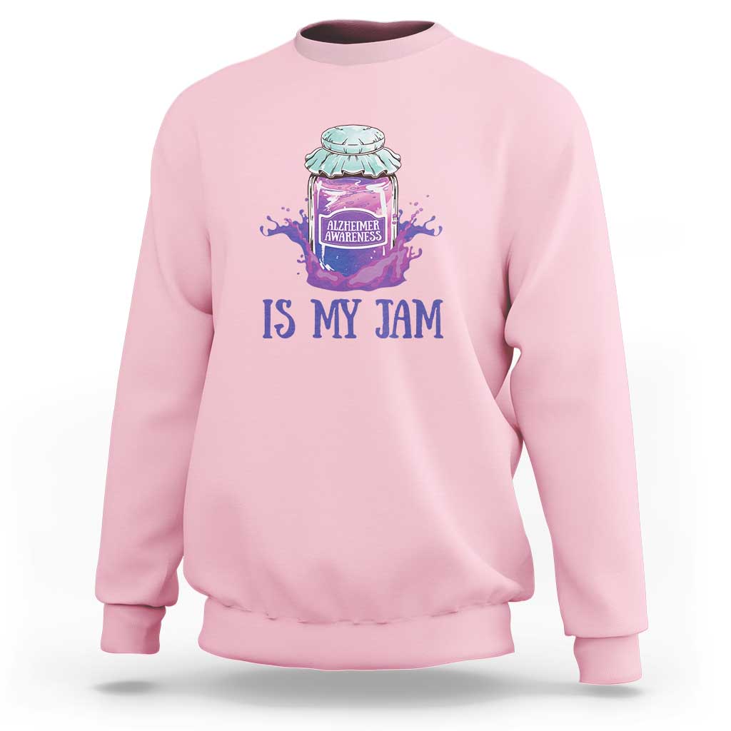 Pink sweatshirt with “IS MY JAM” Alzheimer awareness jar graphic on chest