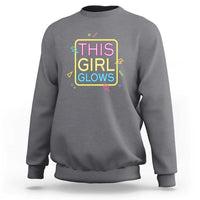 Dark heather gray sweatshirt with neon multicolor “This Girl Glows” front graphic