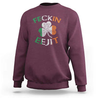 Maroon sweatshirt with shamrock graphic and slogan text on the back
