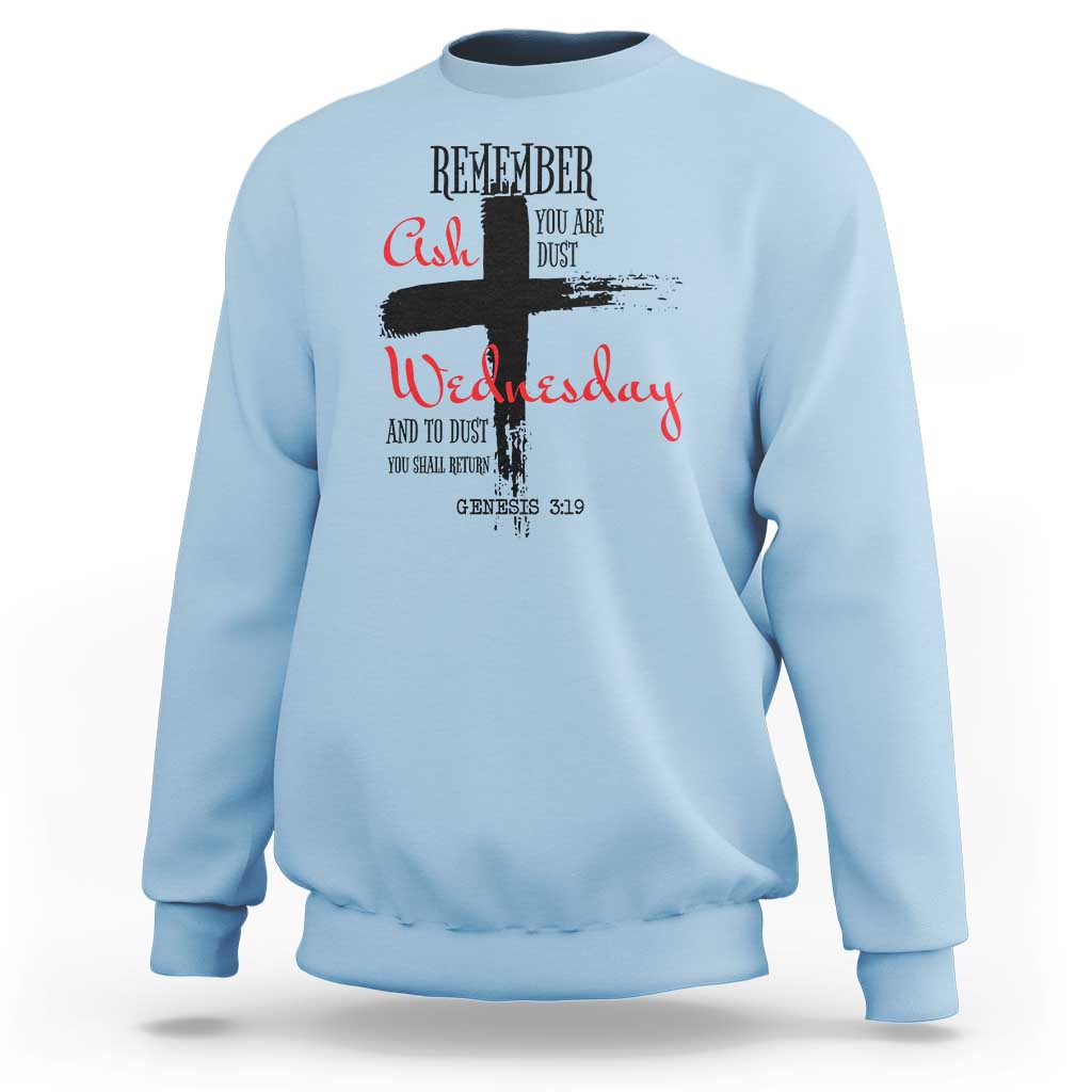 Light blue crewneck sweatshirt with multicolor “Remember Ash Wednesday” cross graphic