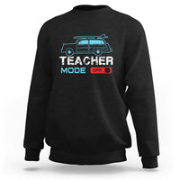 Black crewneck sweatshirt with 'Teacher Mode' van graphic