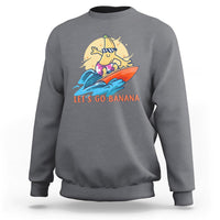 Charcoal banana surfing graphic sweatshirt with “LET’S GO BANANA” text on front
