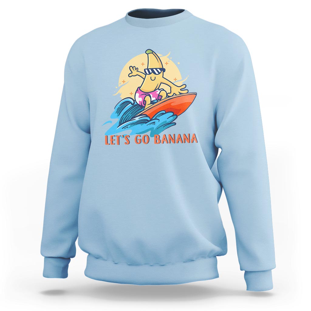 Light Blue banana surfing graphic sweatshirt with “LET’S GO BANANA” text on front