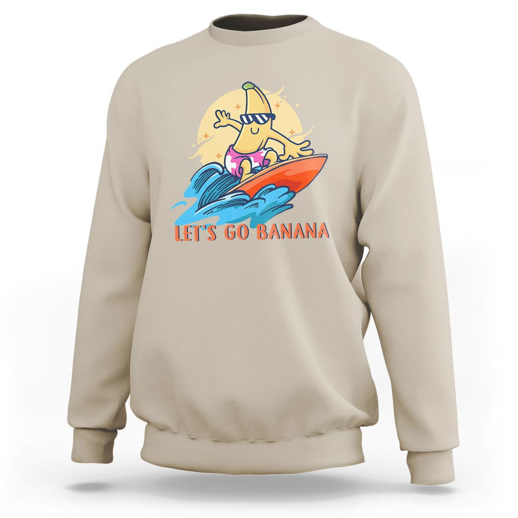 Sand banana surfing graphic sweatshirt with “LET’S GO BANANA” text on front