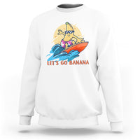 White banana surfing graphic sweatshirt with “LET’S GO BANANA” text on front