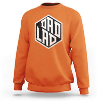 Orange crewneck sweatshirt with large black “ODD LAD” graphic on the chest