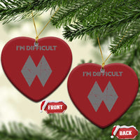 Red heart-shaped ornament with gold hanger, “I’M DIFFICULT” and double diamond graphic.