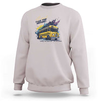 Light gray crewneck sweatshirt with colorful bus graphic and slogan text