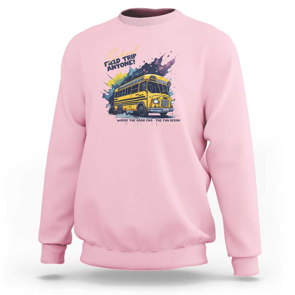 Light pink crewneck sweatshirt with colorful bus graphic and slogan text