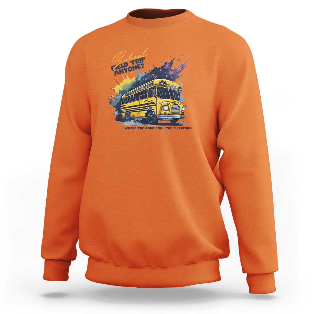 Orange crewneck sweatshirt with colorful bus graphic and slogan text