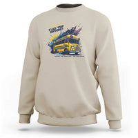 Sand beige crewneck sweatshirt with colorful bus graphic and slogan text