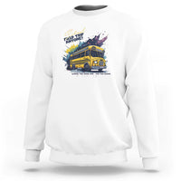 White crewneck sweatshirt with colorful bus graphic and slogan text