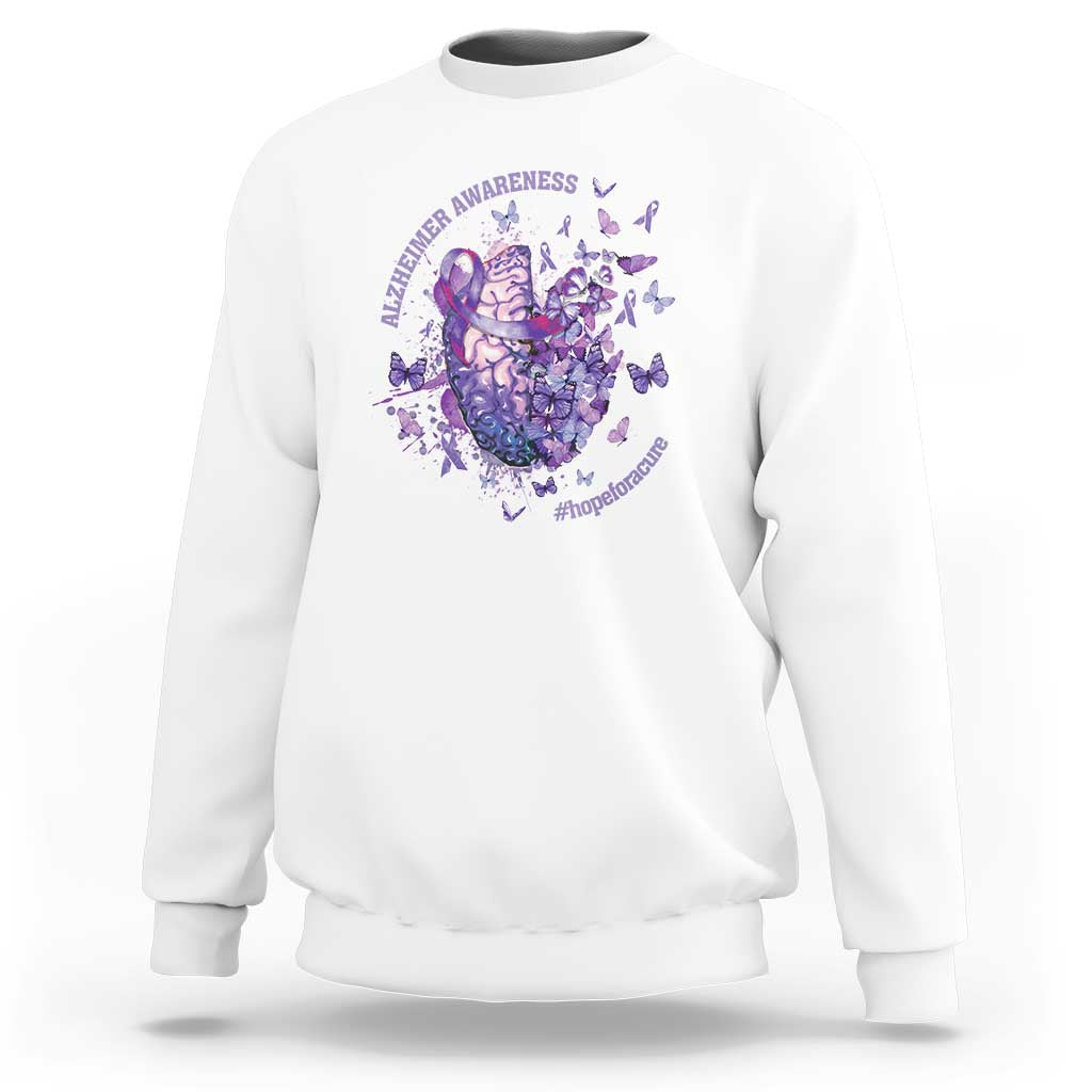 White crewneck sweatshirt with purple awareness heart-and-brain graphic and butterflies on chest