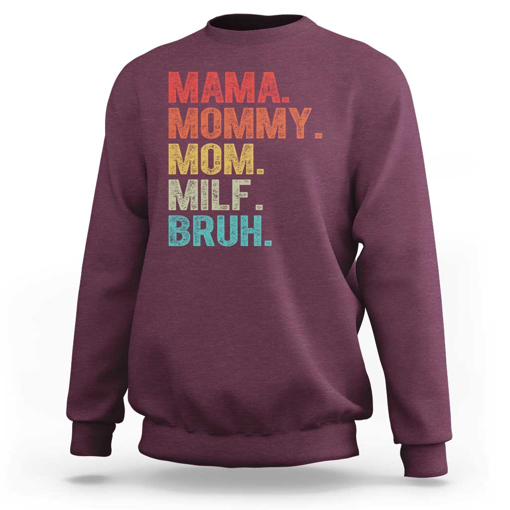 Maroon sweatshirt with colorful text graphic: “MAMA MOMMY MOM MILF BRUH.”