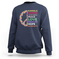 Navy crewneck sweatshirt with colorful floral peace sign and “KAMALA HARRIS” text