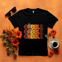 Black turkey gobble graphic T-shirt with three stacked cartoon turkey faces