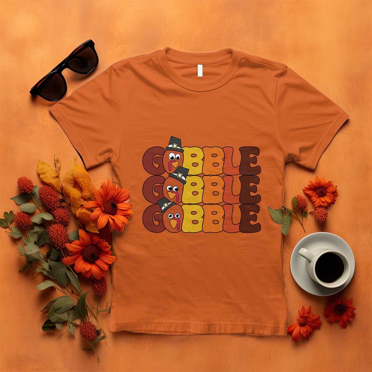 Orange turkey gobble graphic T-shirt with three stacked cartoon turkey faces