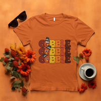 Orange turkey gobble graphic T-shirt with three stacked cartoon turkey faces