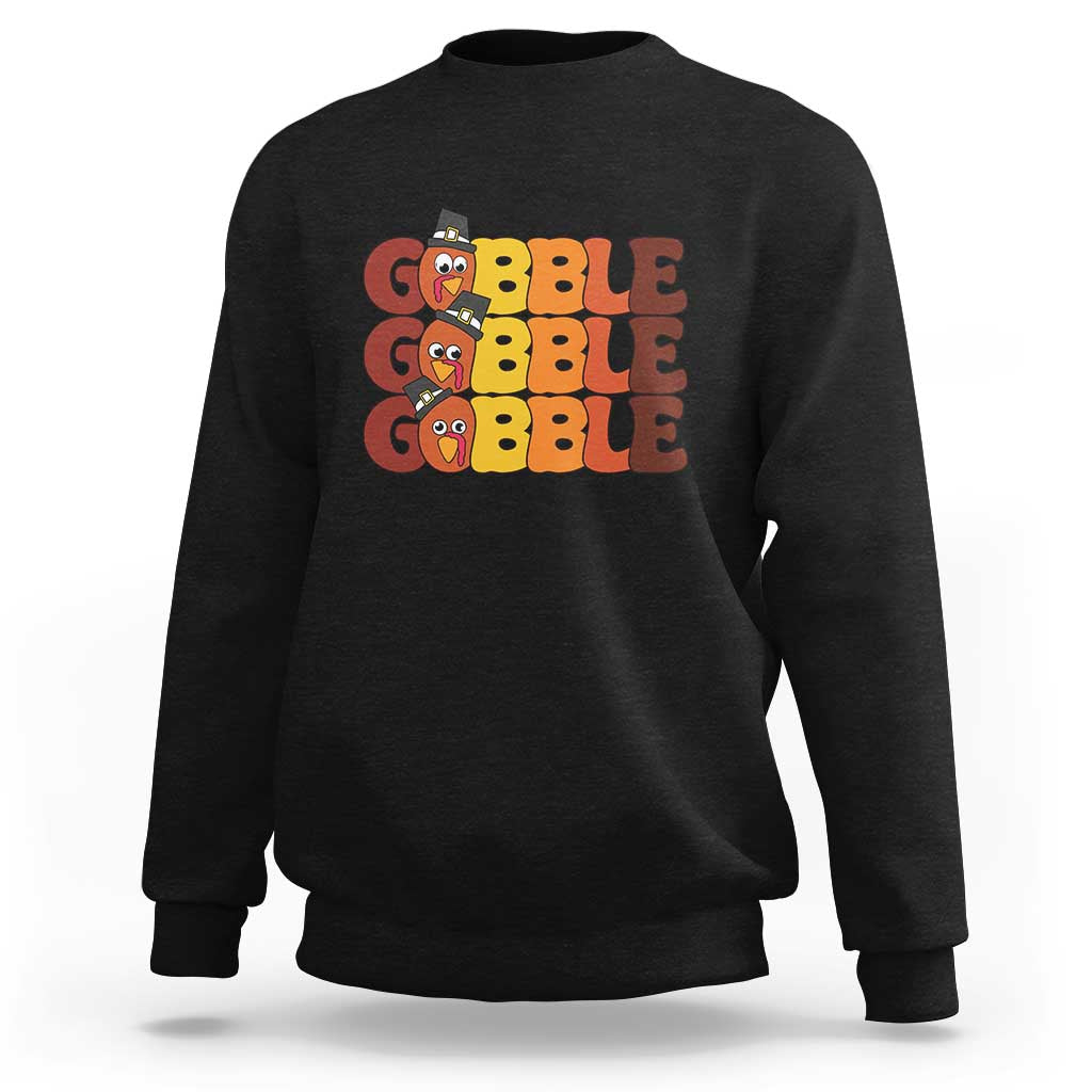 Black sweatshirt with "GOBBLE GOBBLE" turkey graphic on the chest