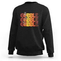 Black sweatshirt with "GOBBLE GOBBLE" turkey graphic on the chest