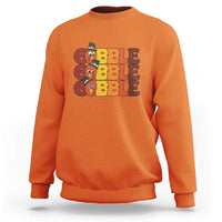 Orange sweatshirt with "GOBBLE GOBBLE" turkey graphic on the chest