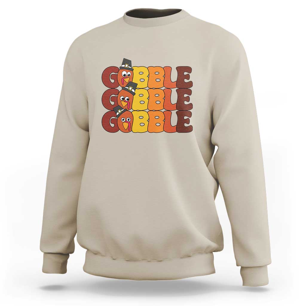 Sand sweatshirt with "GOBBLE GOBBLE" turkey graphic on the chest