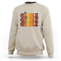 Sand sweatshirt with "GOBBLE GOBBLE" turkey graphic on the chest