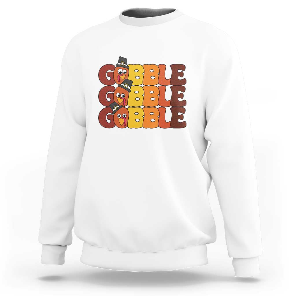 White sweatshirt with "GOBBLE GOBBLE" turkey graphic on the chest