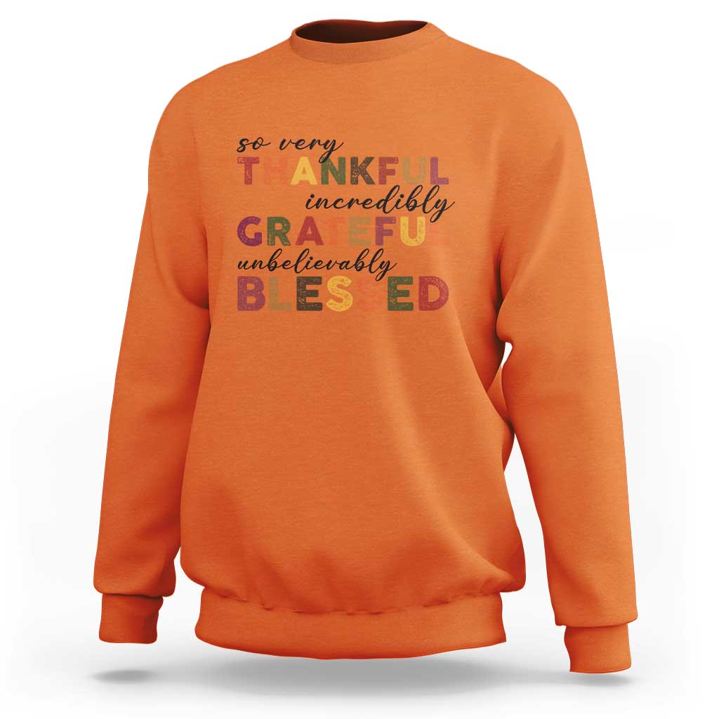Orange Thanksgiving sweatshirt with multicolor “So very Thankful” text