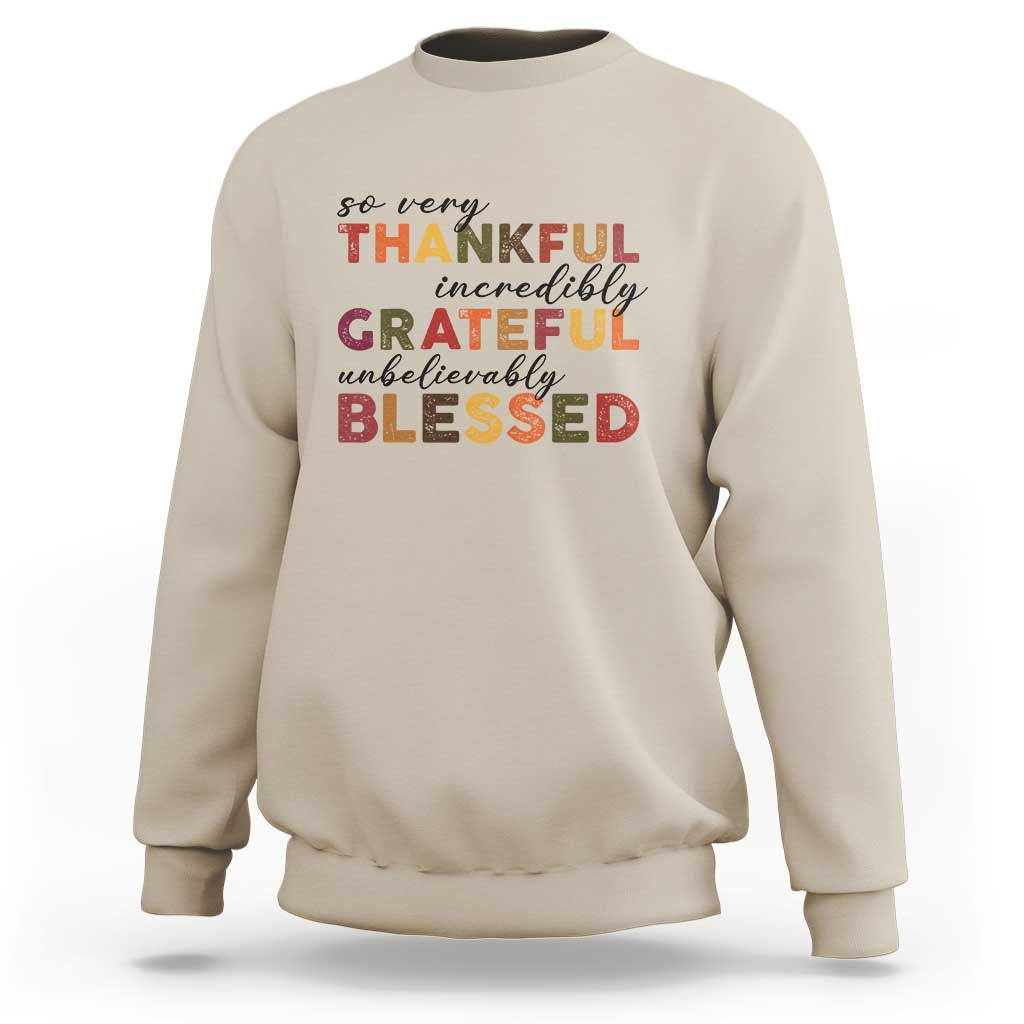 Sand Thanksgiving sweatshirt with multicolor “So very Thankful” text