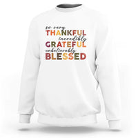 White Thanksgiving sweatshirt with multicolor “So very Thankful” text