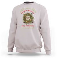 Light gray crewneck sweatshirt with holiday wreath and pentagram graphic