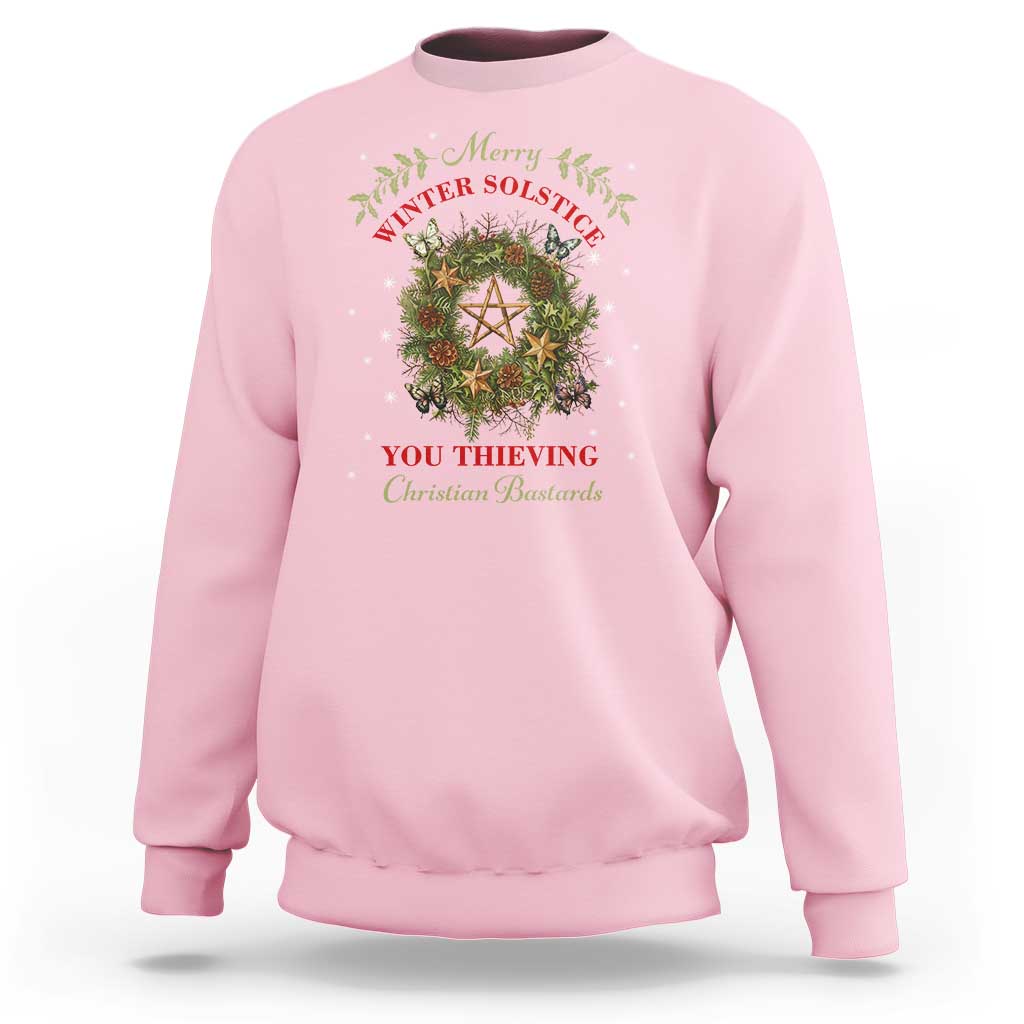 Pink crewneck sweatshirt with holiday wreath and pentagram graphic
