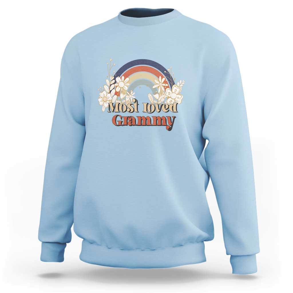 Light blue crewneck sweatshirt with long sleeves and vintage floral rainbow “Most Loved Grammy” graphic
