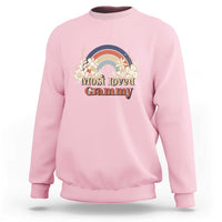 Light pink crewneck sweatshirt with long sleeves and vintage floral rainbow “Most Loved Grammy” graphic