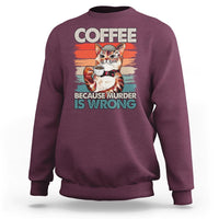 Maroon sweatshirt with cat holding a coffee cup graphic and “BECAUSE MURDER IS WRONG”