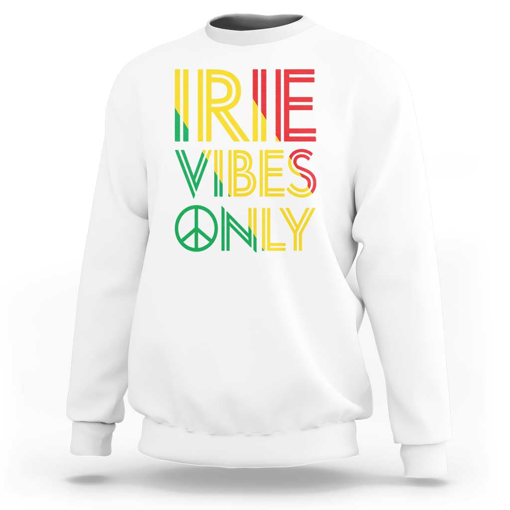 White sweatshirt with “IRIE VIBES ONLY” graphic and peace symbol on front