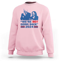 Light pink sweatshirt with blue Harris Walz graphic, WE'RE NOT GOING BACK 2024 flag