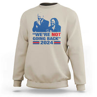 Sand/beige sweatshirt with blue Harris Walz graphic, WE'RE NOT GOING BACK 2024 flag