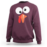 Maroon sweatshirt with playful turkey face graphic, long sleeves