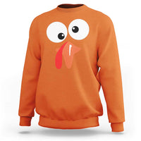 Orange sweatshirt with playful turkey face graphic, long sleeves