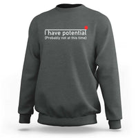 Charcoal gray crewneck sweatshirt with 'I have potential' text print on chest