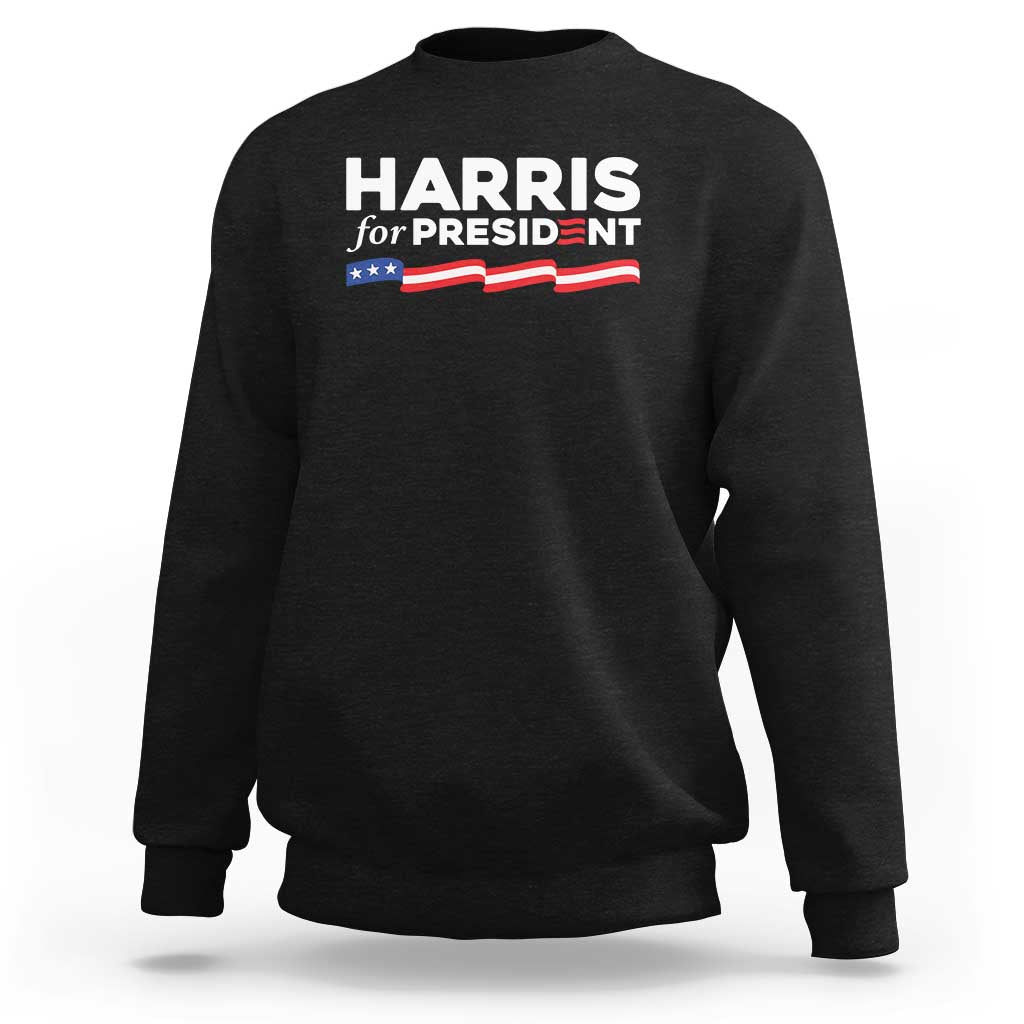 Black sweatshirt with 'HARRIS for PRESIDENT' text and American flag graphic