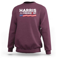Maroon sweatshirt with 'HARRIS for PRESIDENT' text and American flag graphic