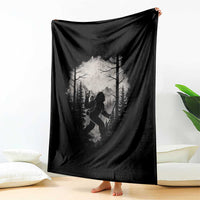 Black Bigfoot forest throw blanket draped over furniture
