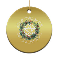 Gold round Christmas ornament with wreath and nativity star, hanging loop